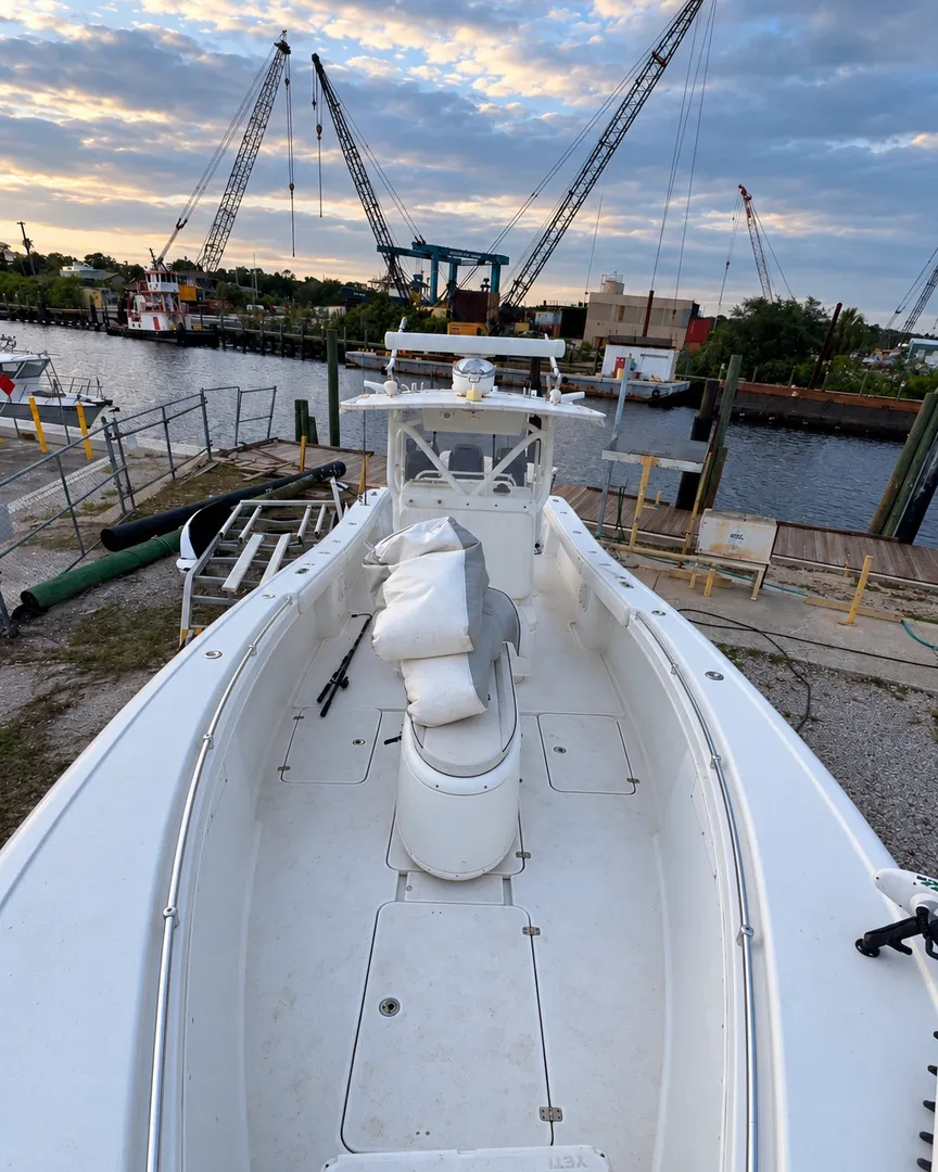 Walking the deck of a center console at the marina before a wash